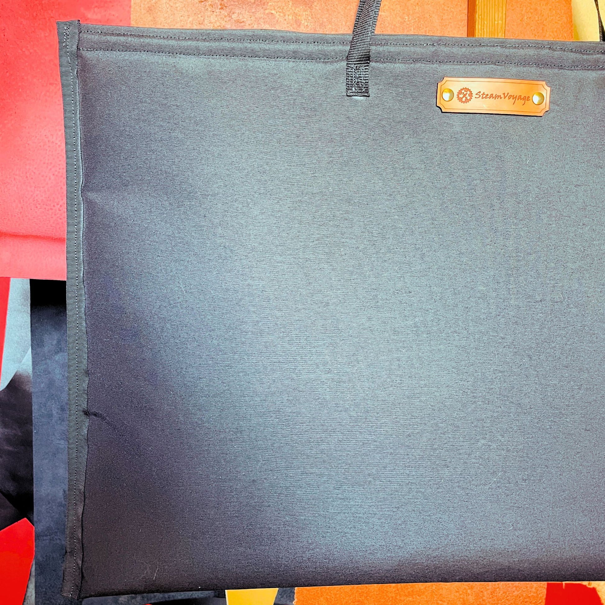 SteamVoyage-borsa in tessuto tempotest nero resistente imbottita con tracolle e rivestimento in raso nero